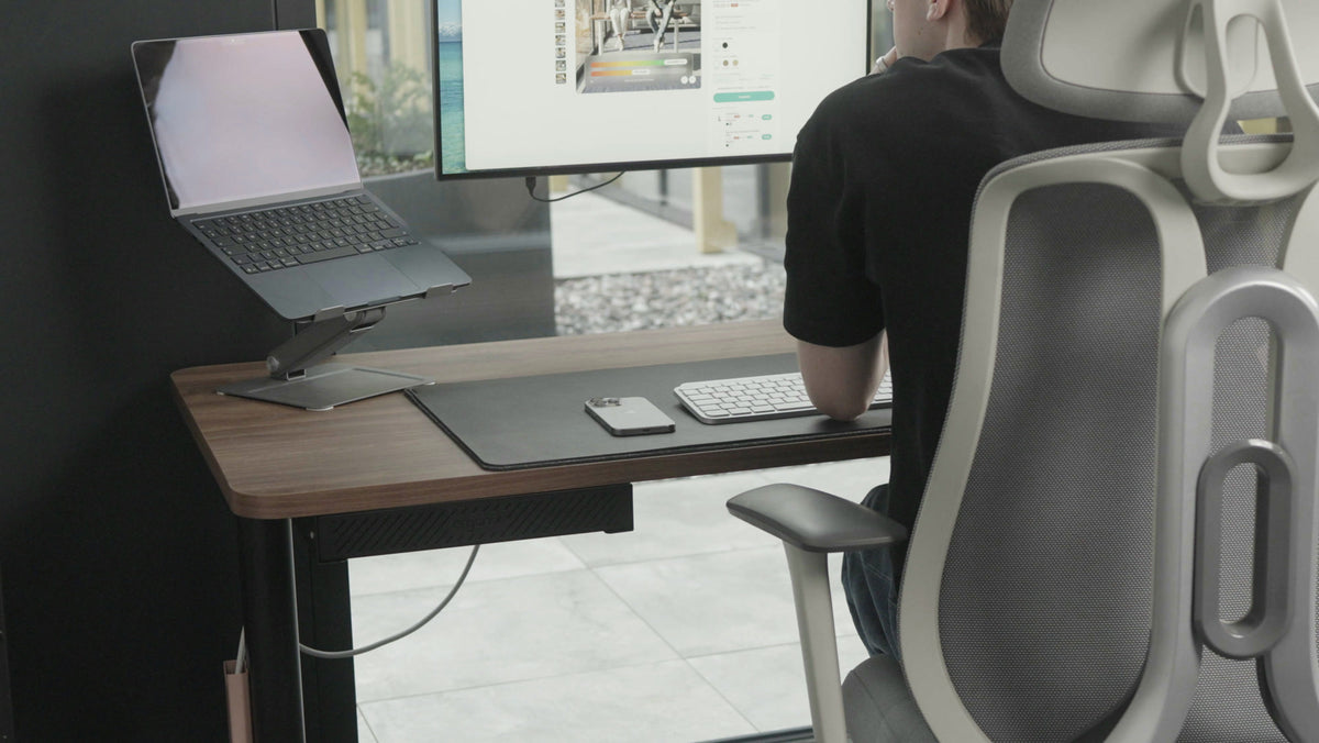 Gustas using an Ergonix desk, a still from real camera footage